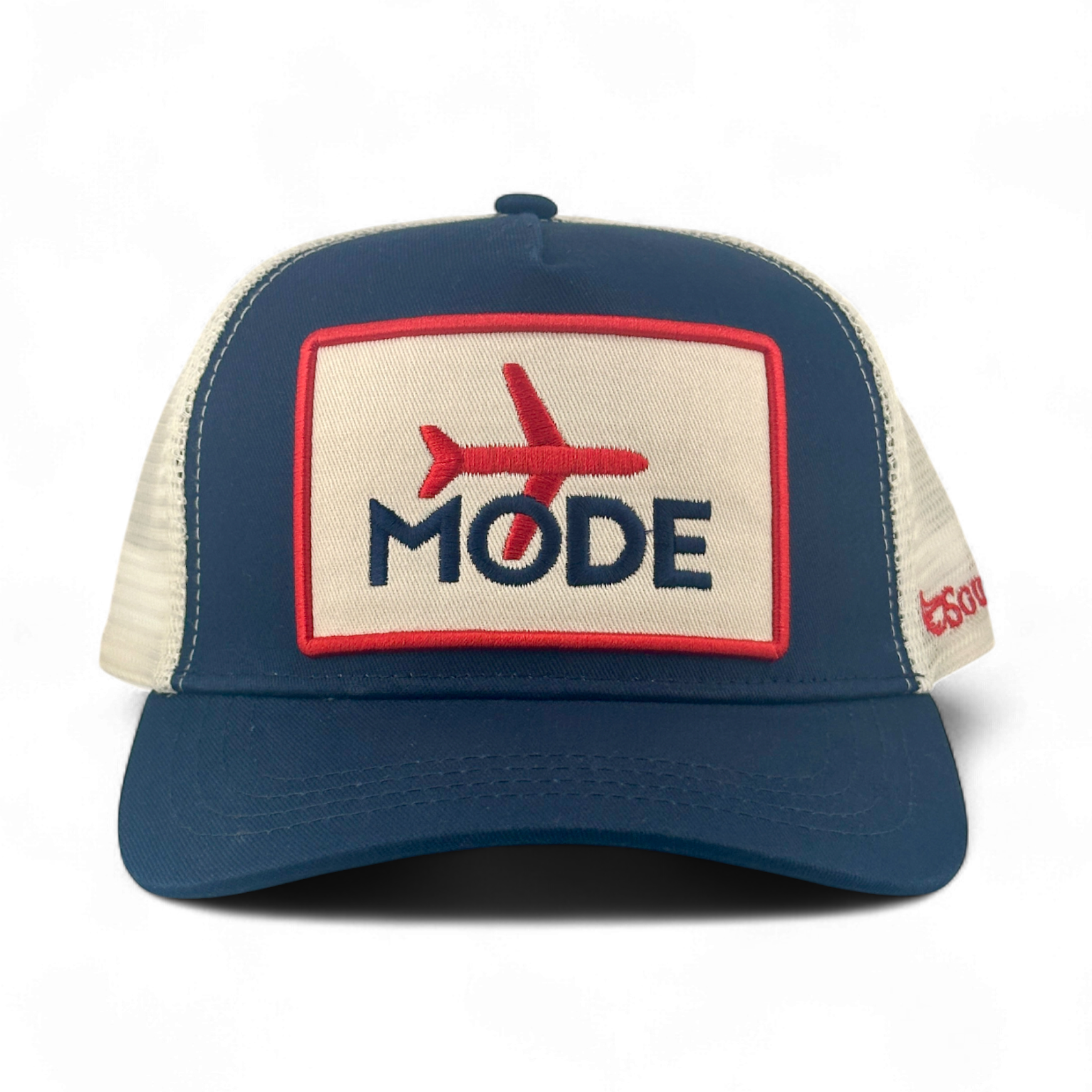 Navy Airplane Mode Trucker Hat with embroidered red airplane patch and cream mesh back