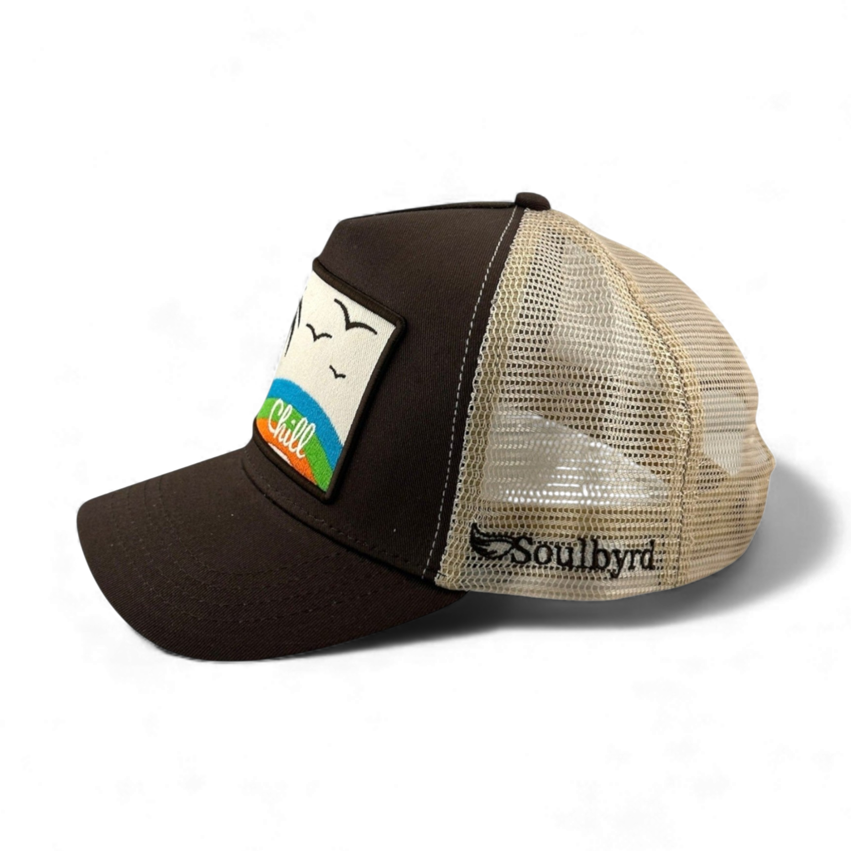 Brown Soulbyrd Chill trucker hat side view with embroidered palm tree and bird patch