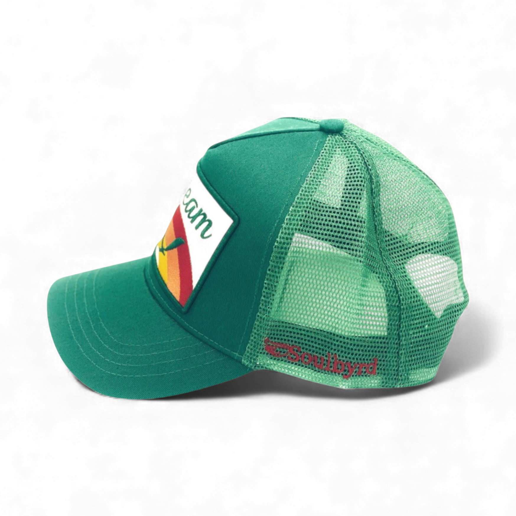Side view of green Soulbyrd trucker hat showing mesh back and red brand embroidery