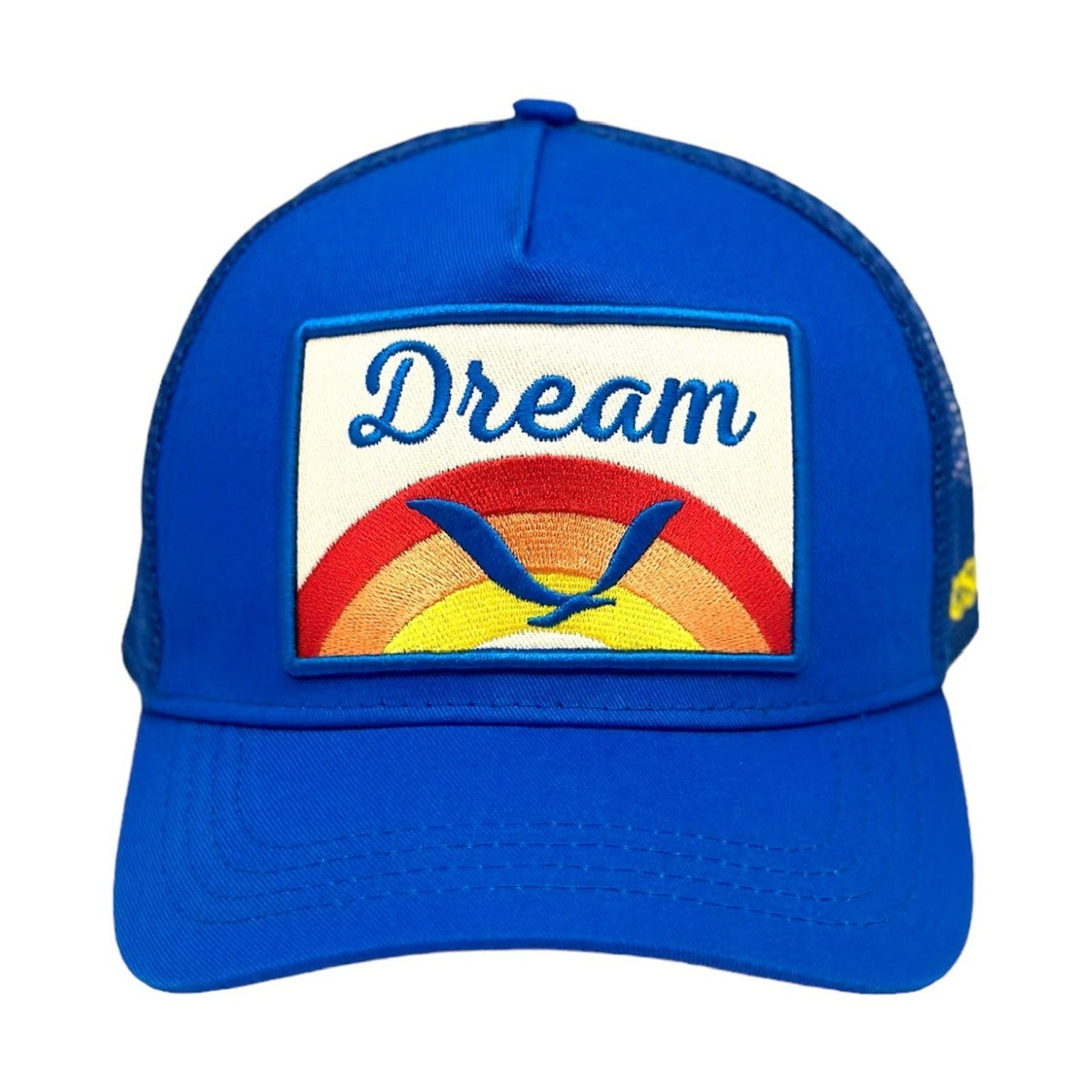 Royal blue Dream trucker hat with rainbow bird patch and white embroidery