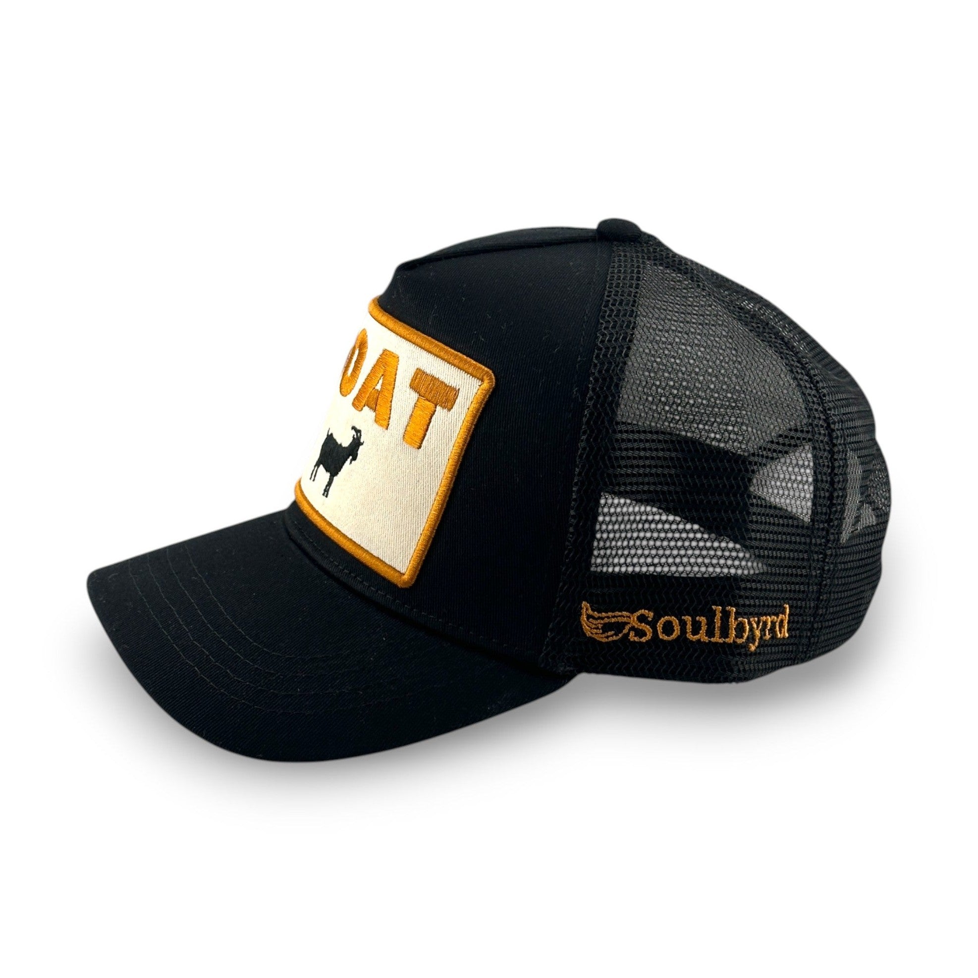 Side view of black mesh back trucker hat showing orange Soulbyrd embroidery