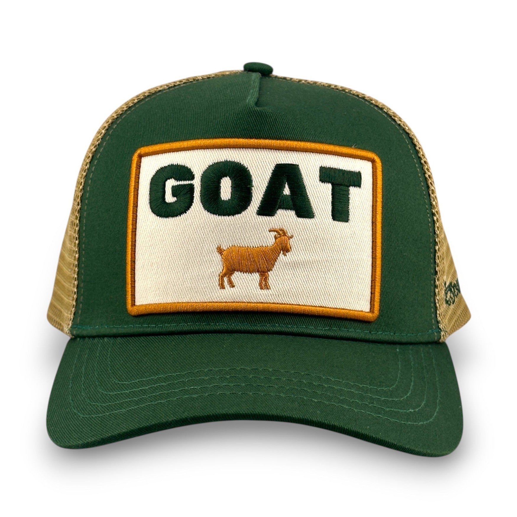 Green cotton twill trucker hat with beige mesh back and embroidered GOAT logo patch