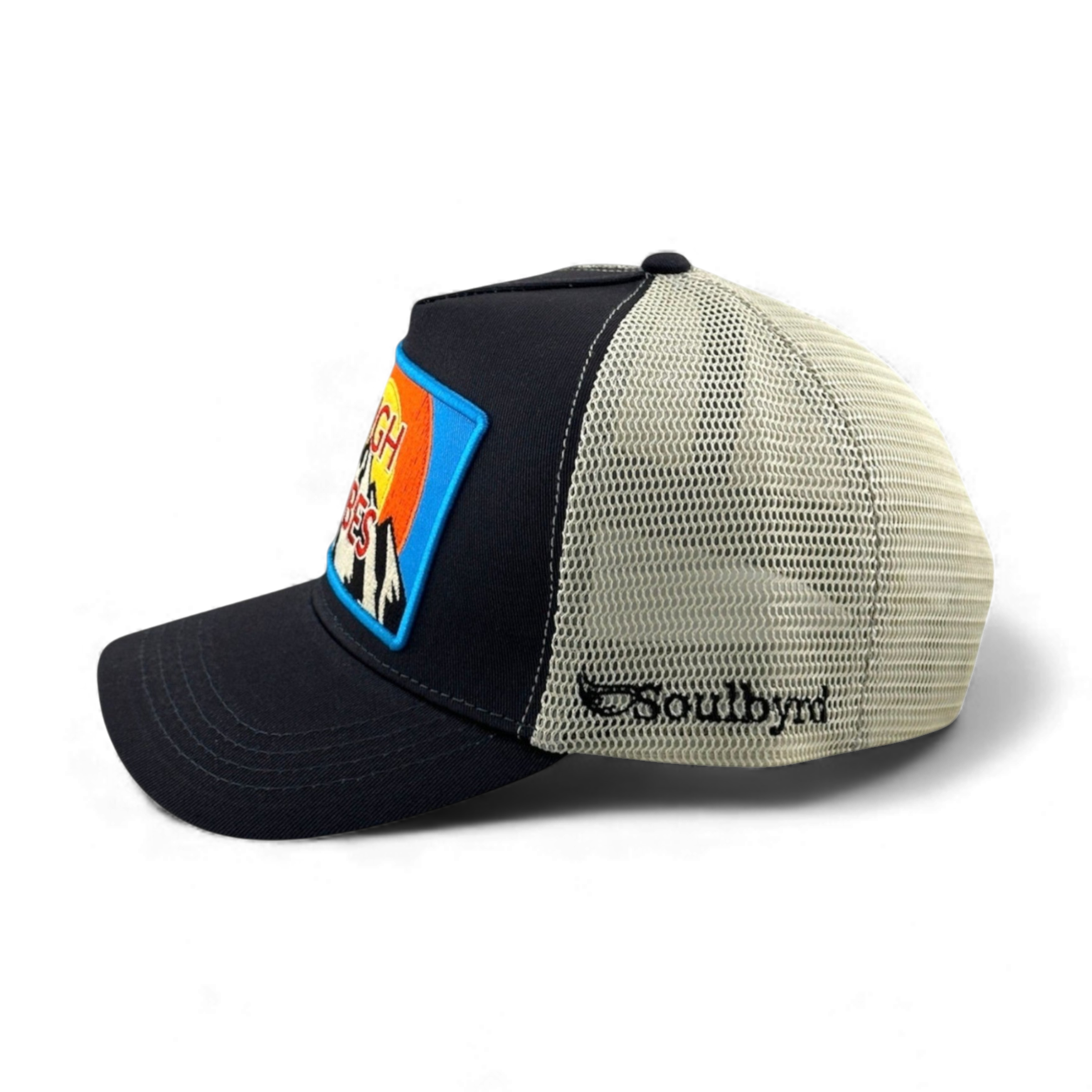 Soulbyrd charcoal trucker hat side view showing beige mesh back and embroidered brand logo