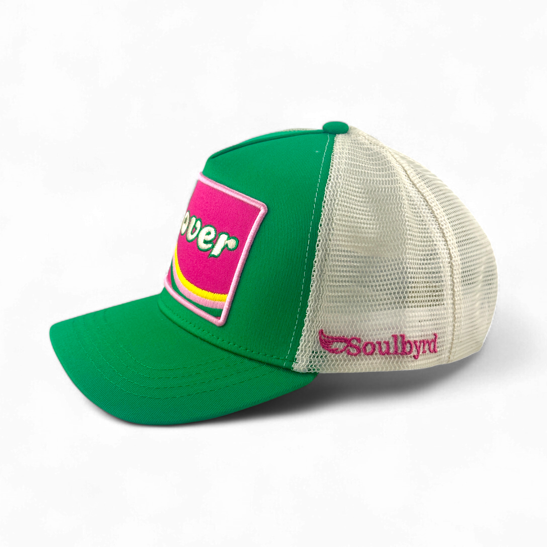 Green Soulbyrd trucker hat side view showing mesh back and logo