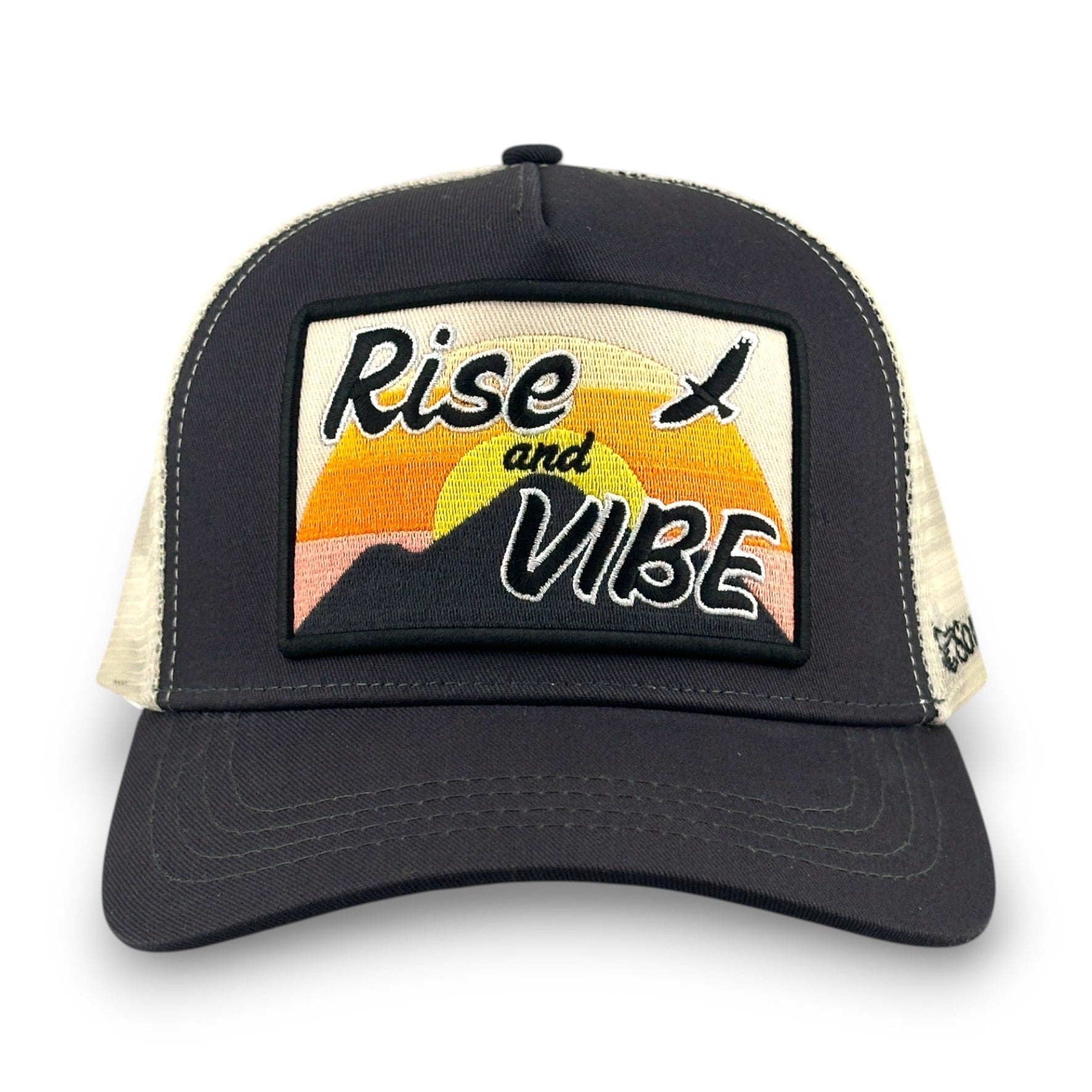 Front view of charcoal Rise & Vibe trucker hat featuring embroidered sunset mountain and eagle patch