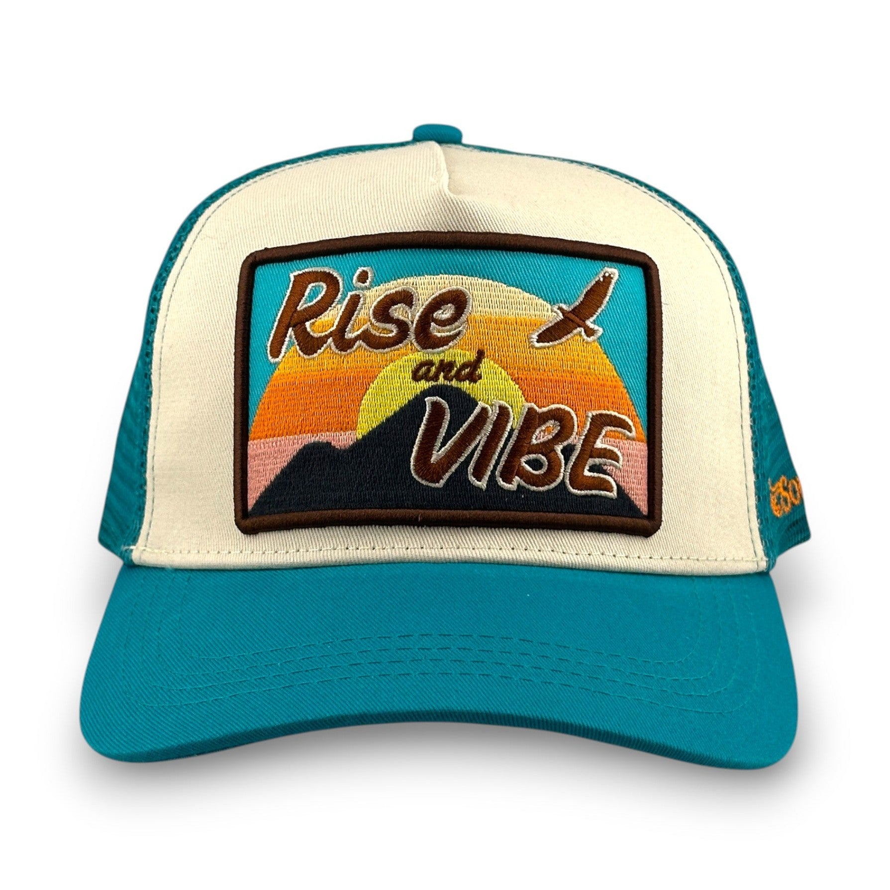 Rise & Vibe turquoise cotton twill trucker hat with embroidered sunset mountain eagle patch