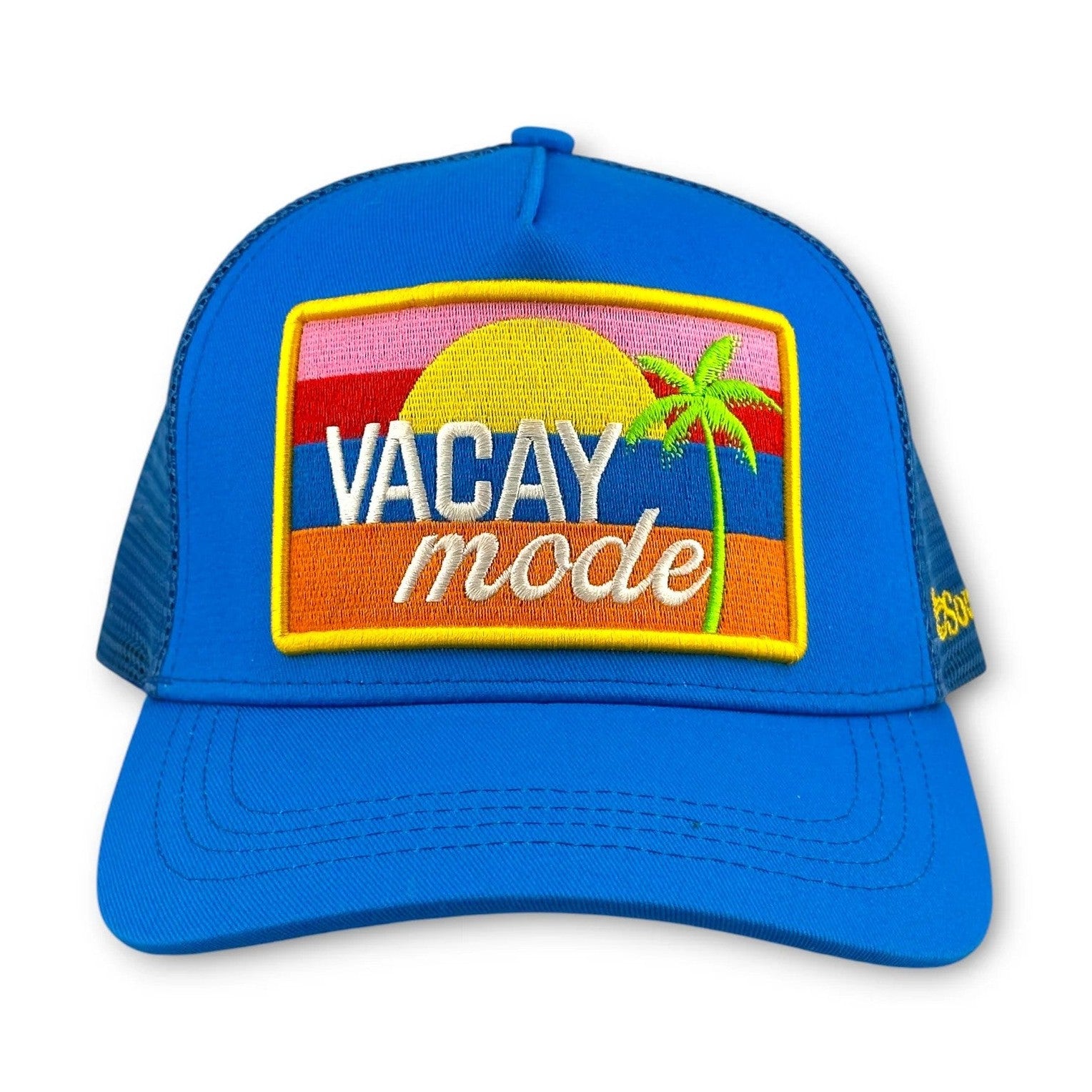 Front view of blue cotton twill trucker hat featuring VACAY mode sunset embroidery
