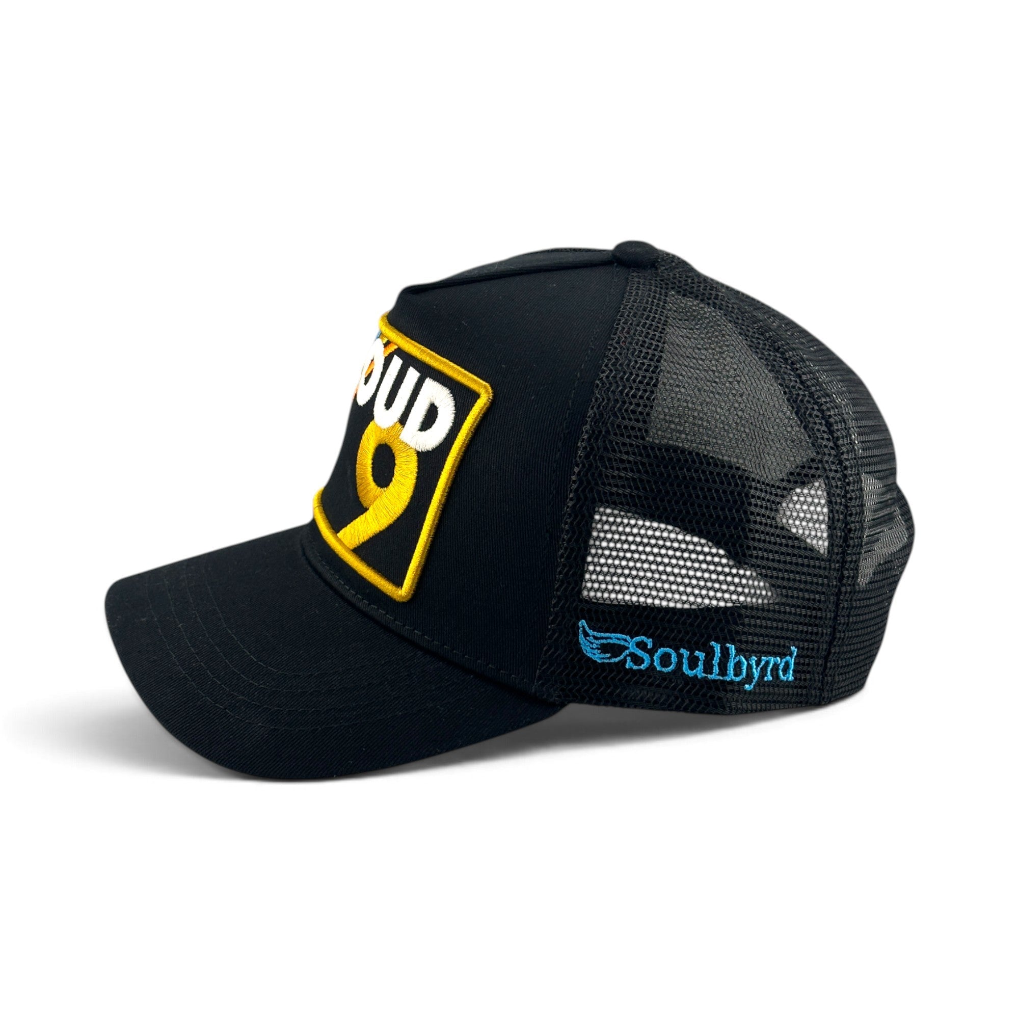 Soulbyrd Wholesale black 5-panel trucker hat with cotton twill front, mesh back, and Cloud 9 yellow embroidered patch