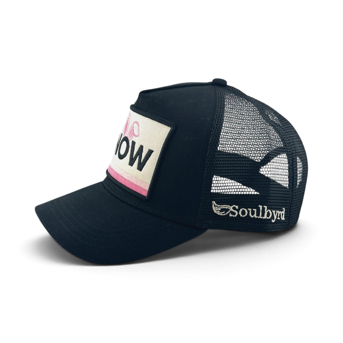 Soulbyrd Wholesale black 5-panel trucker hat with cotton twill front, nylon mesh back, and Snow Bunny patch detail.