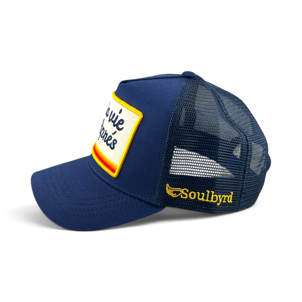 Soulbyrd Wholesale blue 5-panel trucker hat with cotton twill front, nylon mesh back, and La Vie Après patch