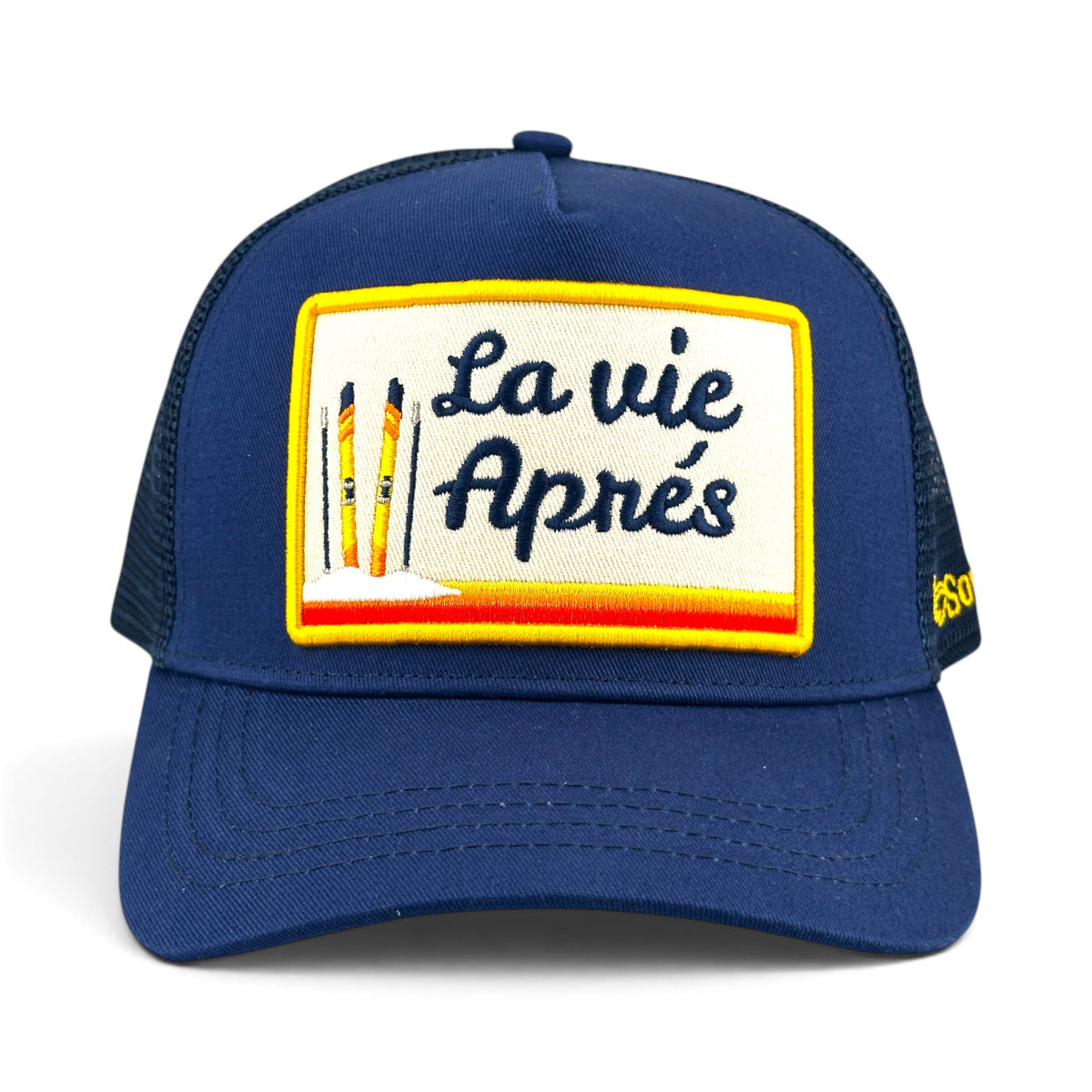 Soulbyrd Wholesale blue 5-panel trucker hat with cotton twill front and mesh back featuring La Vie Après ski patch