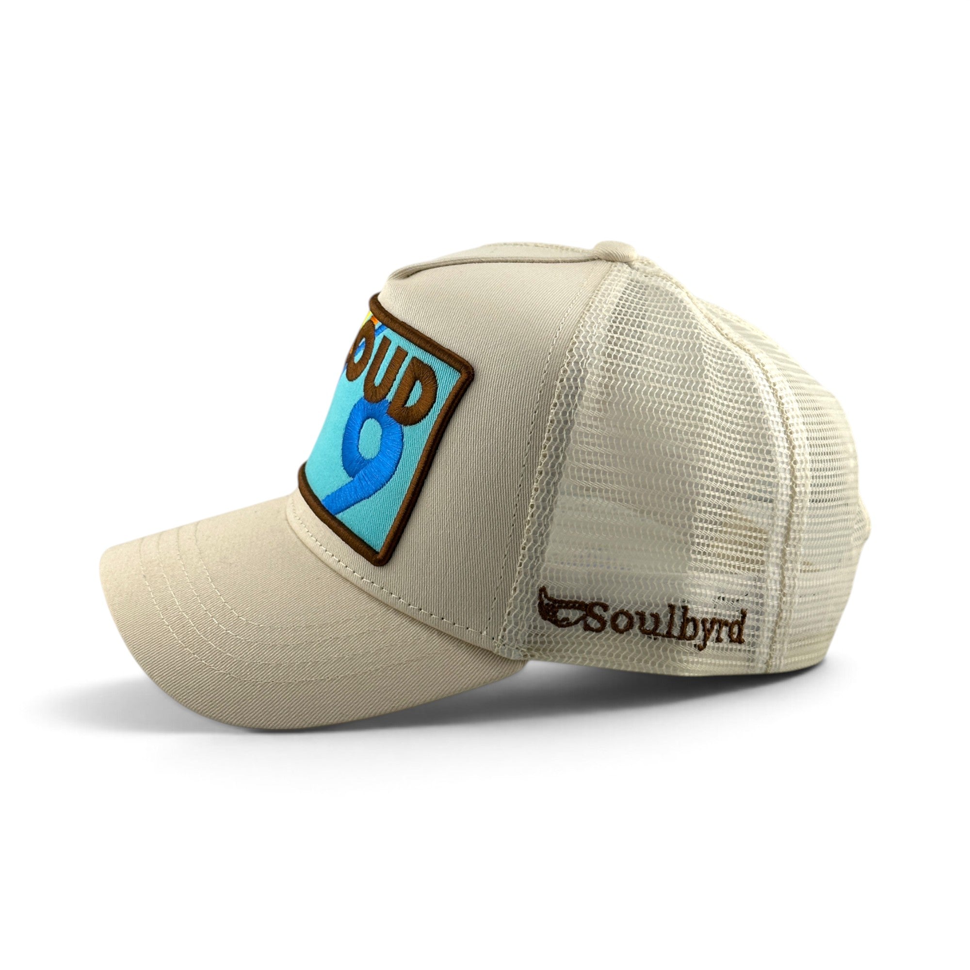 Soulbyrd Wholesale Cloud 9 cream trucker hat with cotton twill front, nylon mesh back, and adjustable snapback.