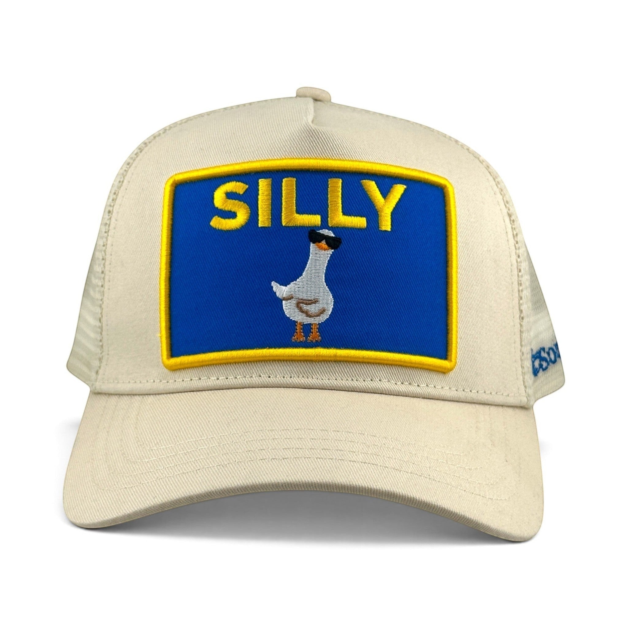 Soulbyrd Wholesale cream trucker hat with a blue patch featuring a silly goose wearing sunglasses and the word SILLY