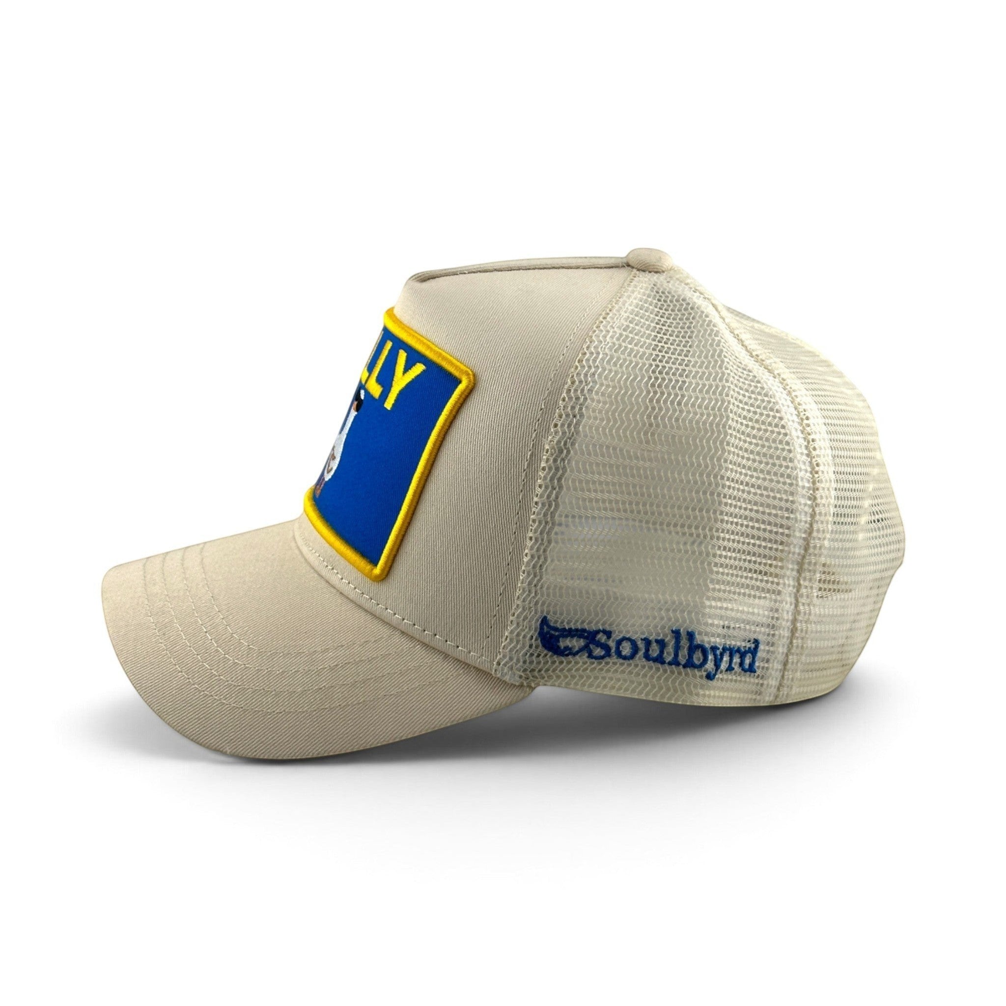 Soulbyrd Wholesale cream trucker hat with cotton twill front, mesh back, and Silly Goose patch, side view.