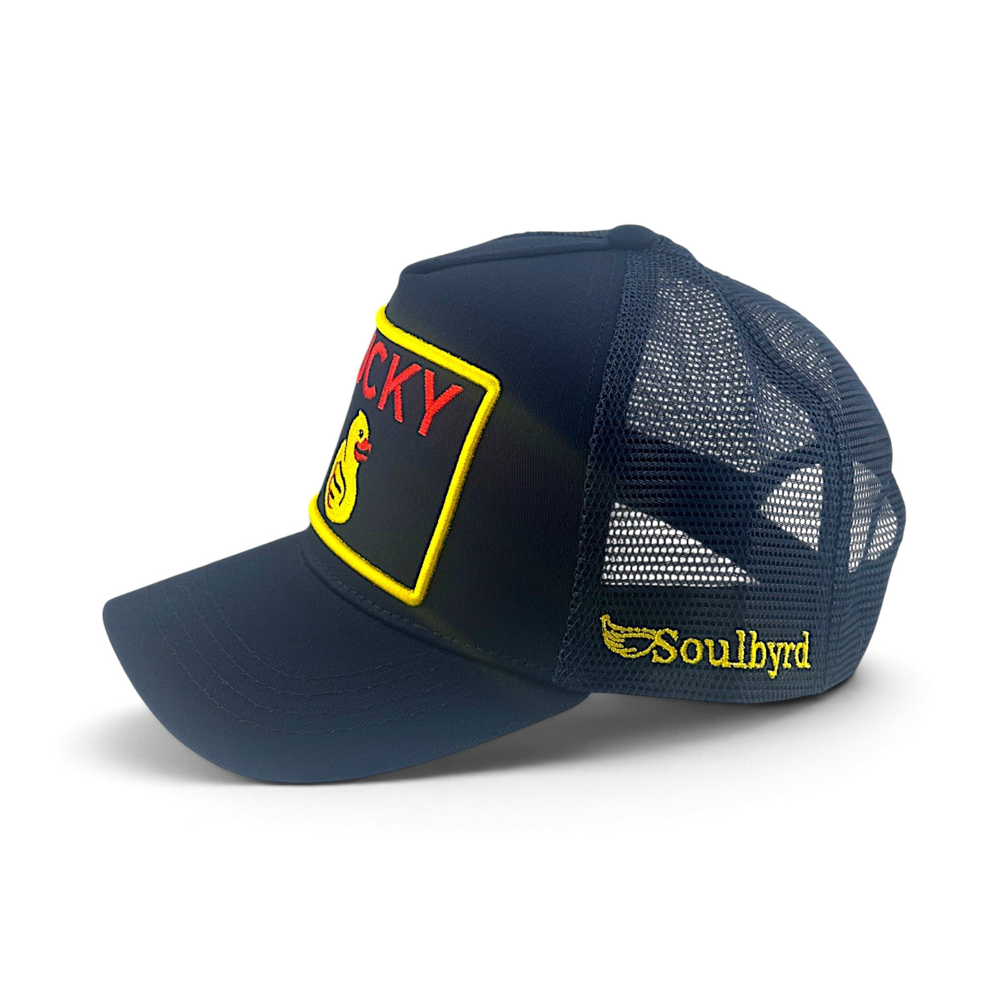 Soulbyrd Wholesale indigo cotton twill trucker hat with Lucky Duck patch and adjustable snapback closure