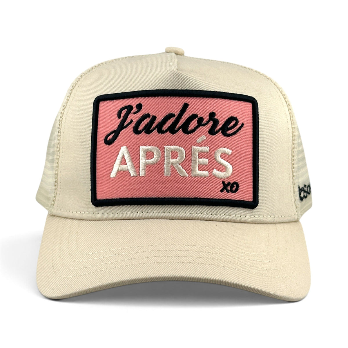 Soulbyrd Wholesale ivory cotton trucker hat with a pink rectangular patch reading J'adore APRÉS in black and white.