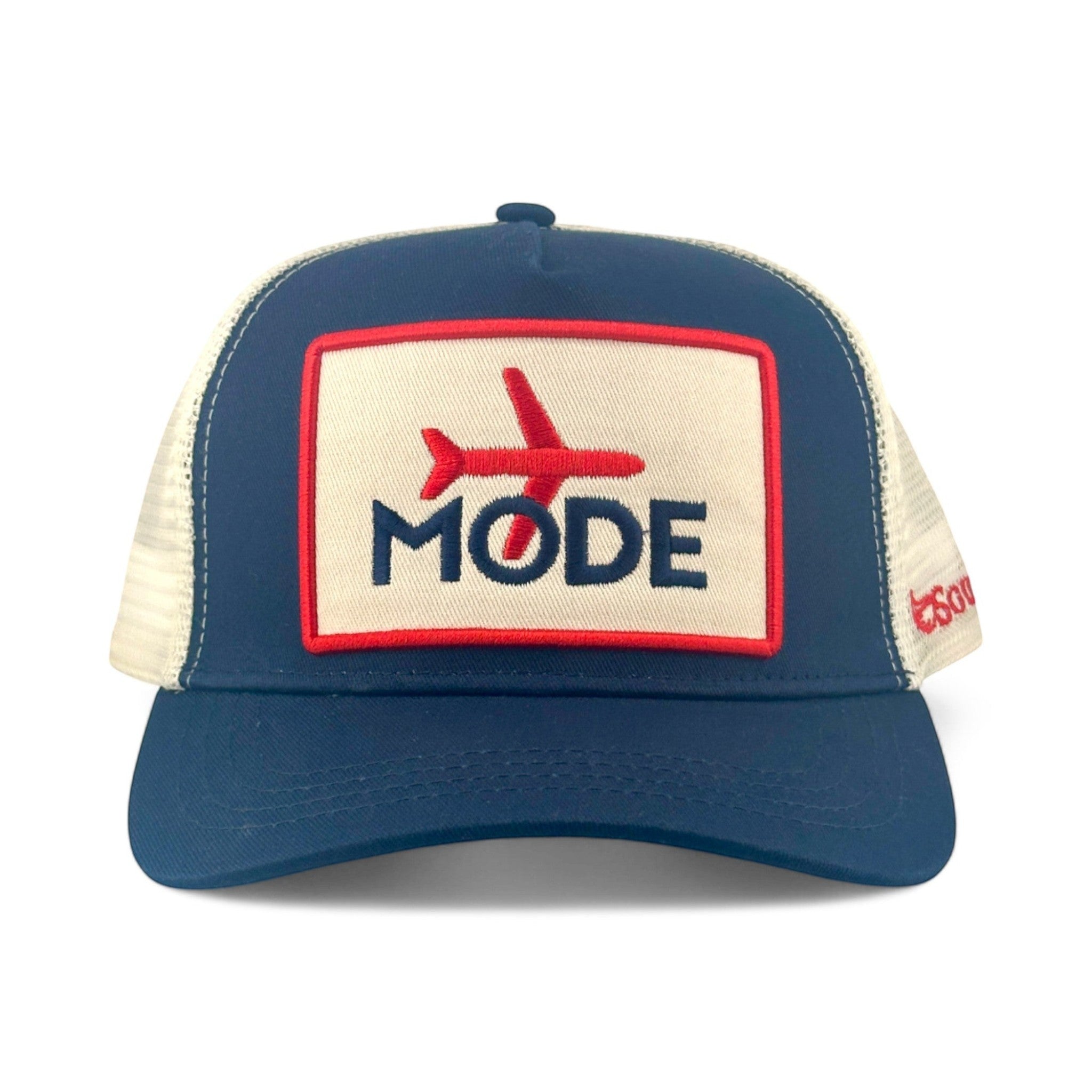 Soulbyrd Wholesale navy cotton and nylon mesh trucker hat with Airplane Mode patch and adjustable snapback closure.