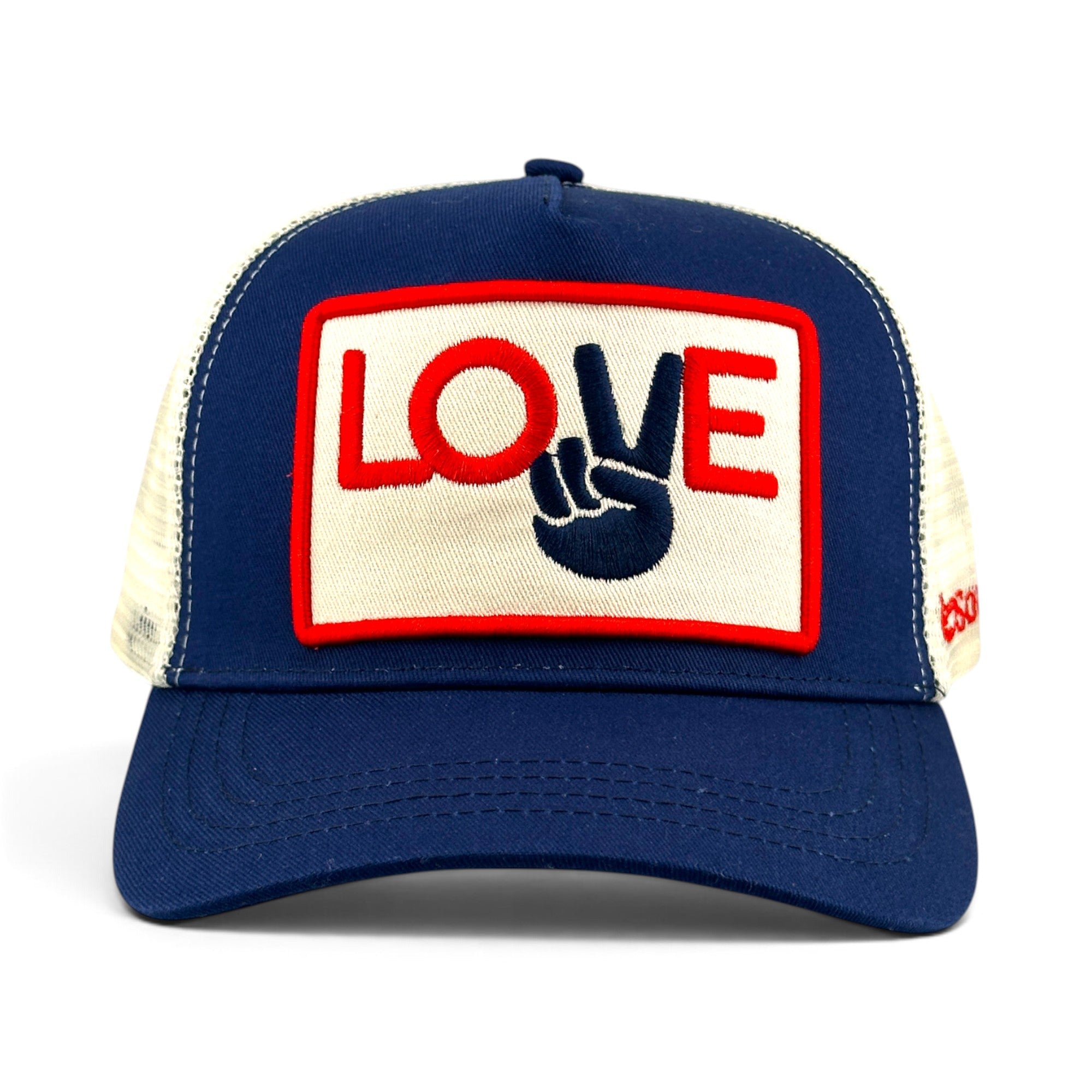 Soulbyrd Wholesale navy trucker hat with cotton twill front and white mesh back featuring a Love peace sign patch.