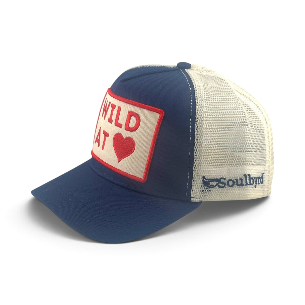 Soulbyrd Wholesale navy and white trucker hat with Wild at Heart patch and mesh back