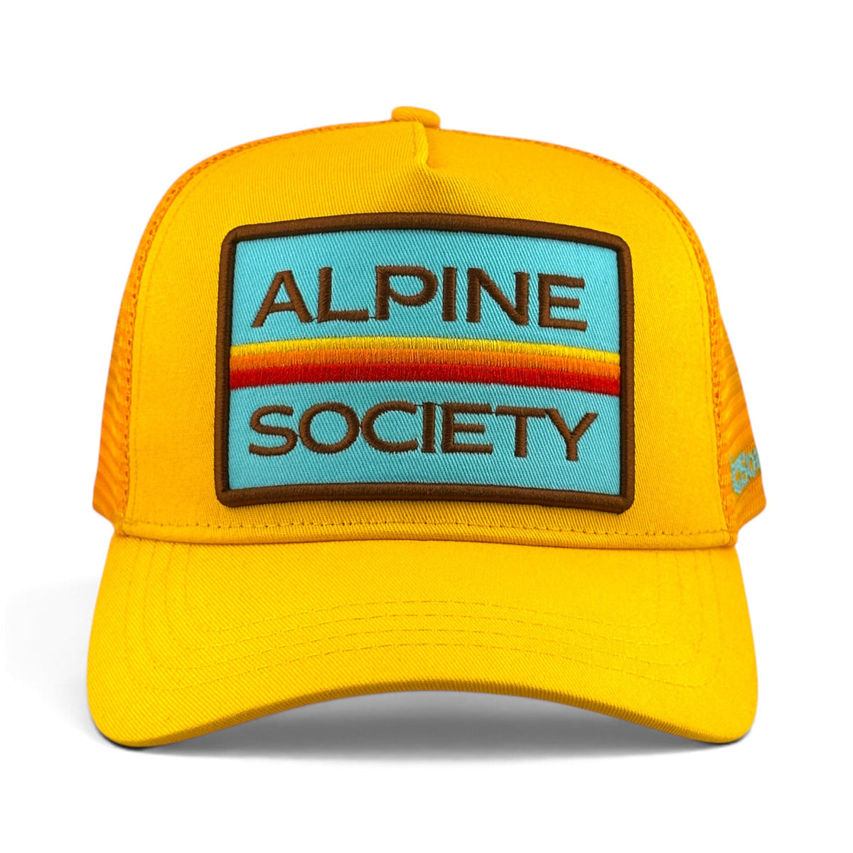 Soulbyrd Wholesale yellow 5-panel trucker hat with Alpine Society patch, cotton twill crown, and nylon mesh back.